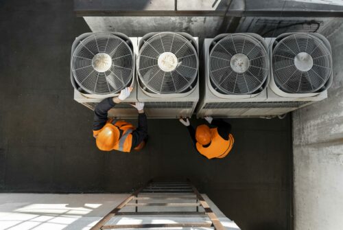 men-working-with-equipment-full-shot